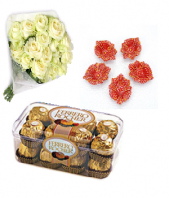 Luxury white roses with sweet Ferrero Rocher 16 pc and Designed Earthen Diyas Gifts toMylapore, Combinations to Mylapore same day delivery
