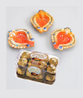 Orange Diyas and Ferrero Rocher 16 pc Gifts toAshok Nagar, Combinations to Ashok Nagar same day delivery